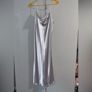 Bebe silky material dress size SMALL hugs the body with room to breathe.